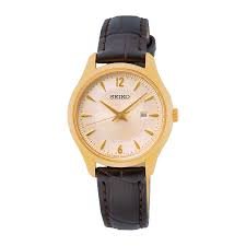 Seiko SUR478P1 features a gold dial, black leather strap & quartz movement. A timeless women’s watch perfect for daily elegance & formal occasions.